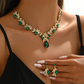 Köp 2, få 1 gratis🔥 ✨ Set med halsband och örhängen med glittrande droppformade hängsmycken – strassdetaljer, matchande design & lätt att bära – perfekt för bröllop och fest 💎